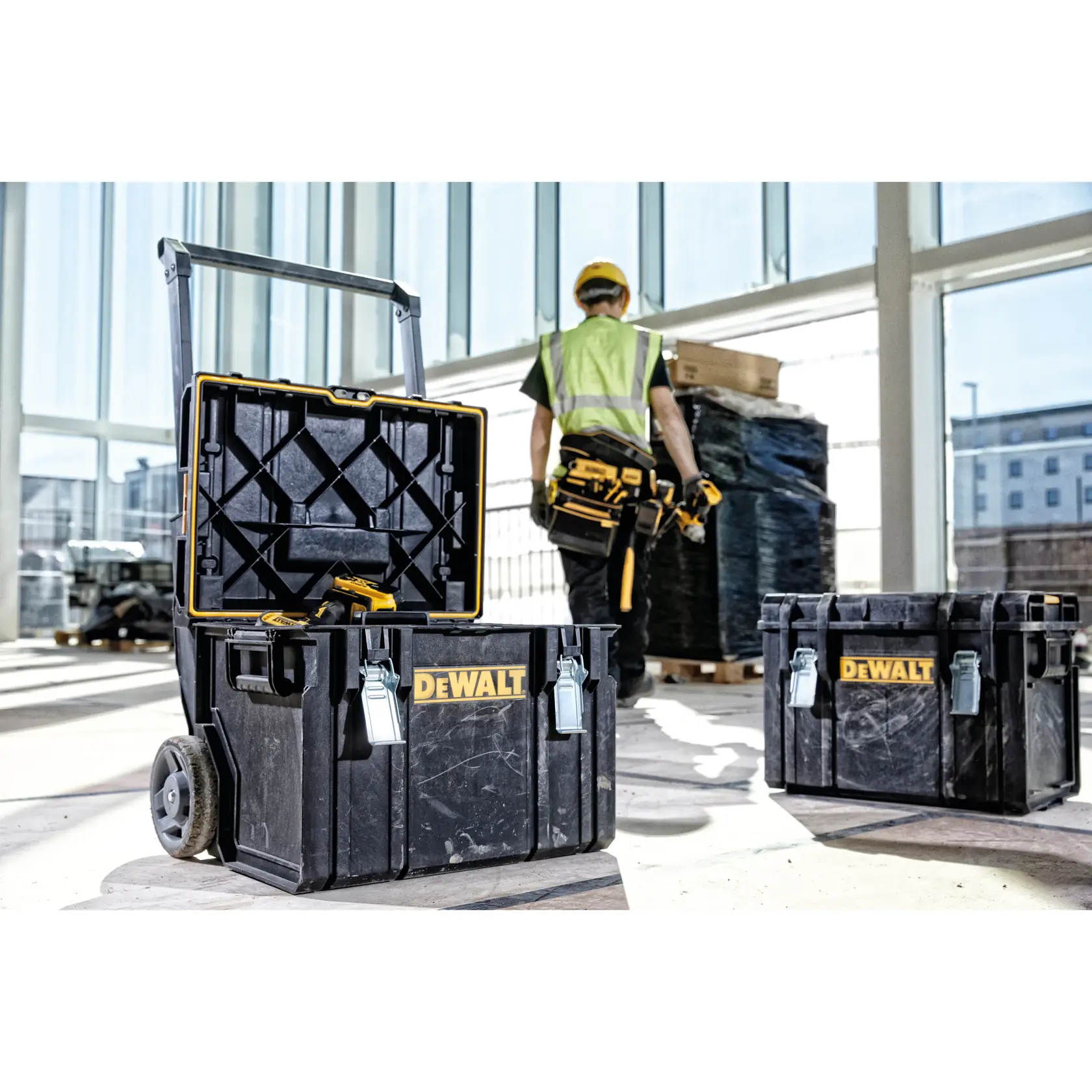 DEWALT ToughSystem 2.0 promotional graphic with the slogan 'Storage Built to Handle It' in large, bold yellow lettering on a dark, textured background.